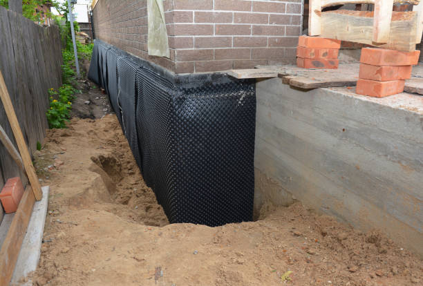 SJ Waterproofing Pros technician performing targeted Exterior Waterproofing assessment in Foley, MN